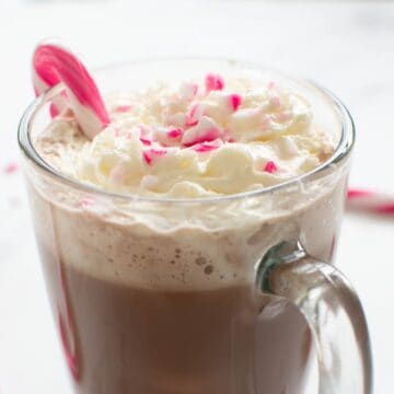 Peppermint coffee with candy cane on top.