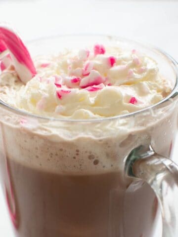 Peppermint coffee with candy cane on top.