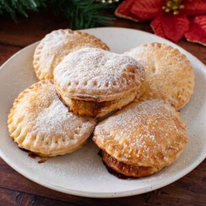 Puff pastry mince pies with icing sugar.