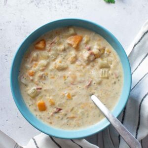 A bowl of ham and potato soup.