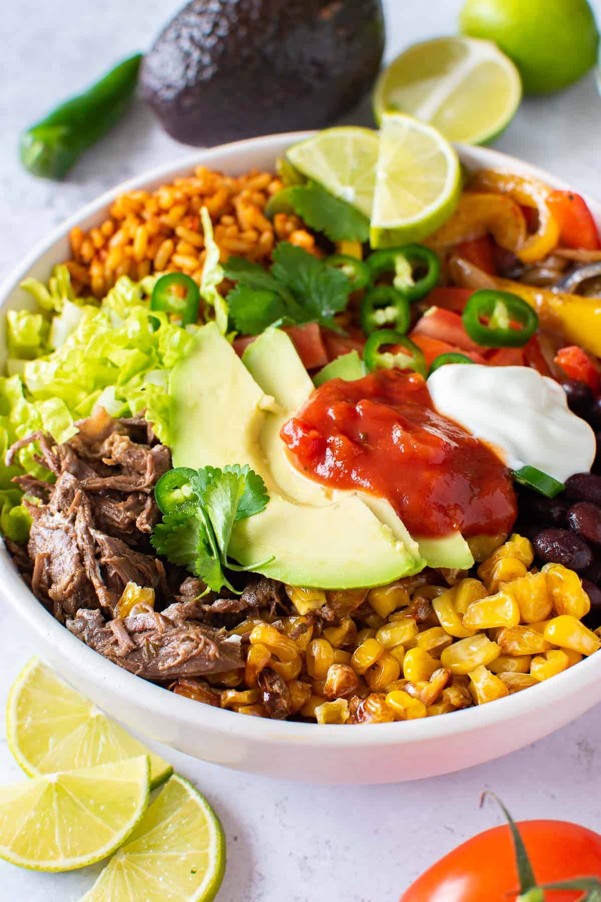 A large Mexican rice plate with vegetables on the side.