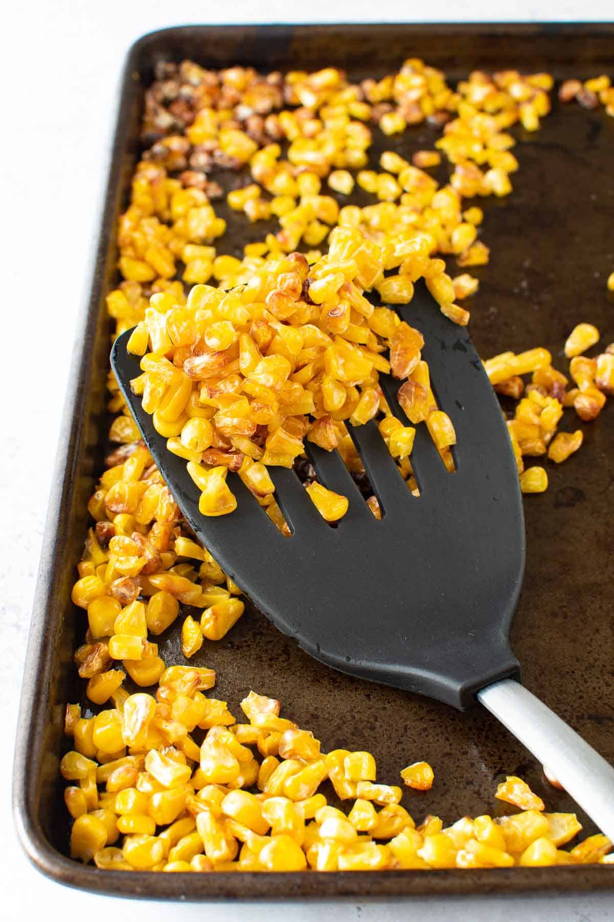 Roasted corn on a sheet pan.