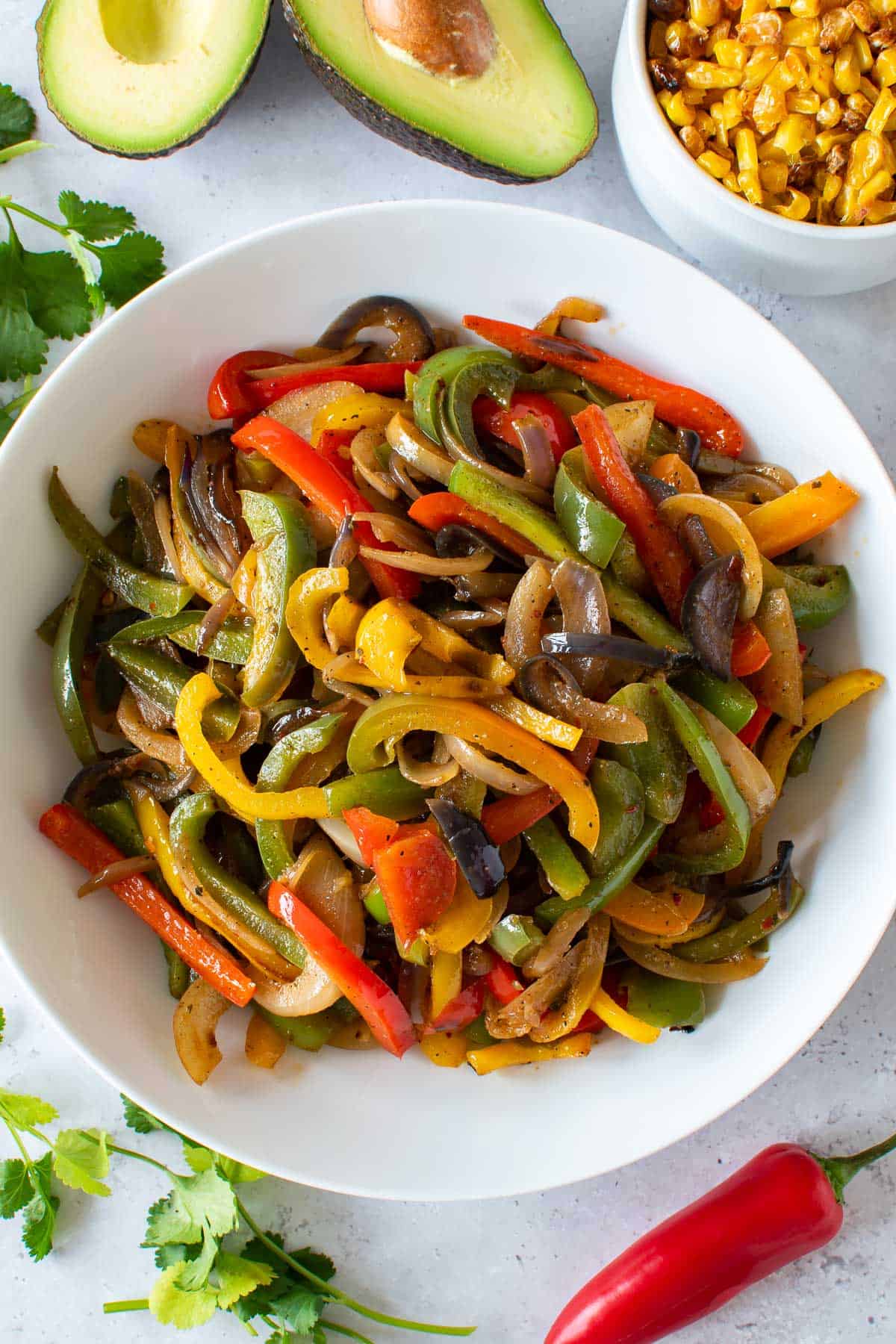 Sauteed peppers and onions in a bowl.