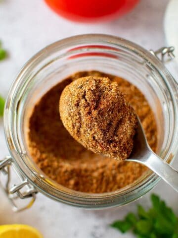 Shawarma spice mix in a spoon.