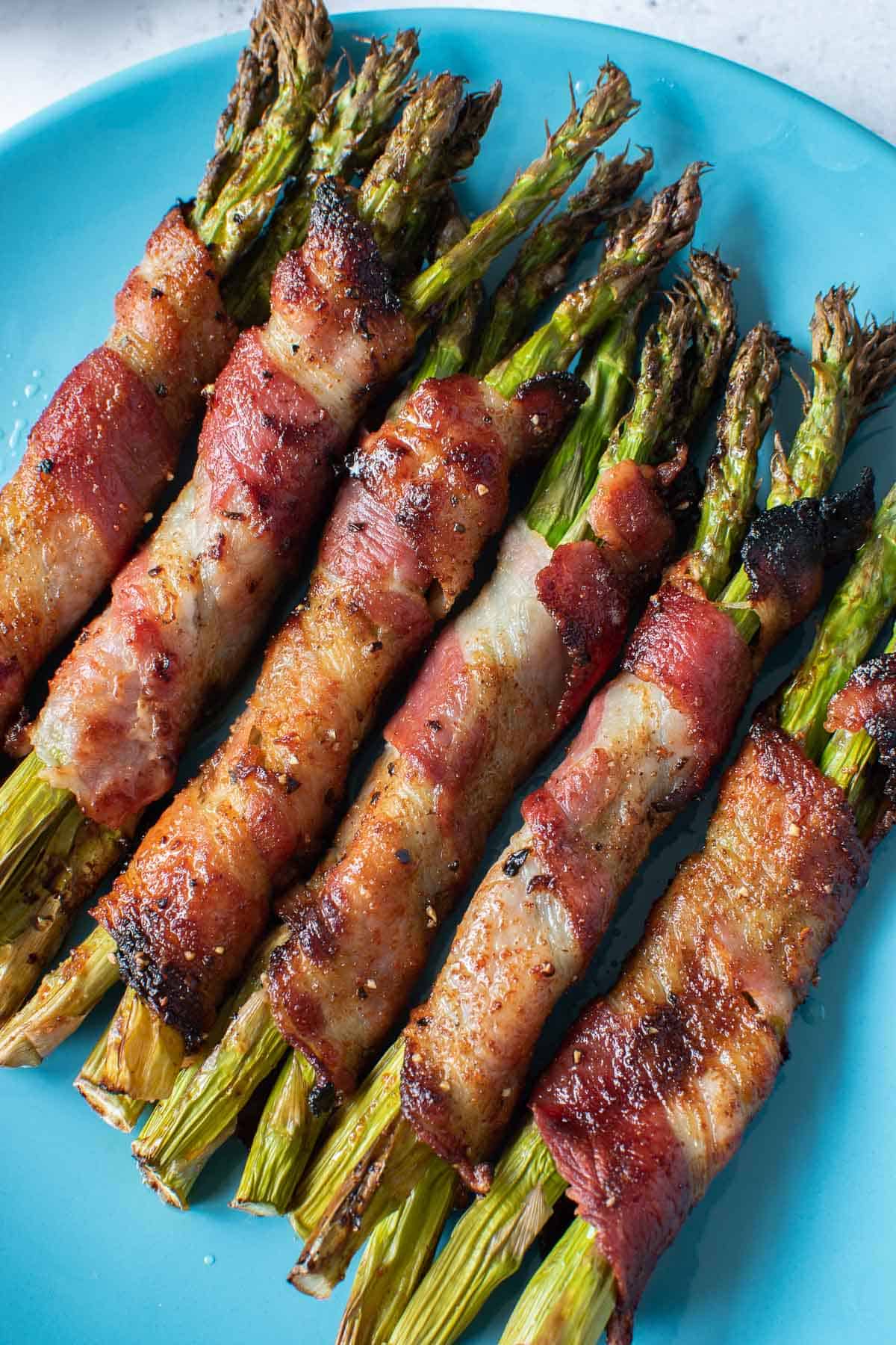 Crispy air fried bacon wrapped asparagus.