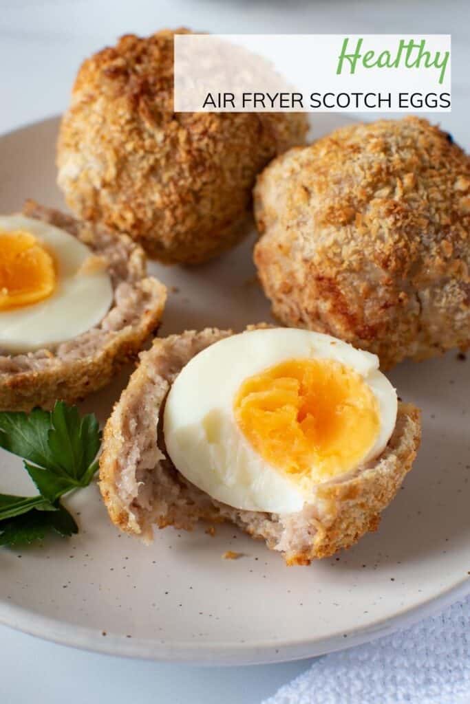 Air fried scotch eggs on a plate.