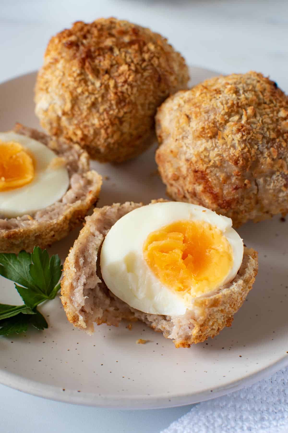 A British scotch egg with a bite taken out of it.