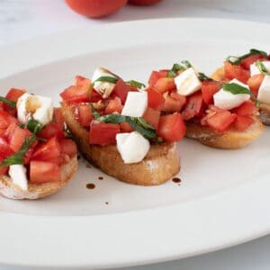 Bruschetta with mozzarella on a plate.