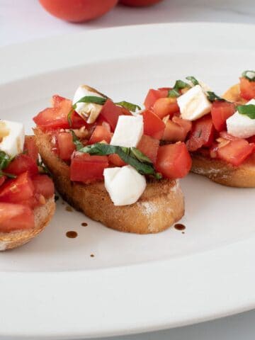 Bruschetta with mozzarella on a plate.