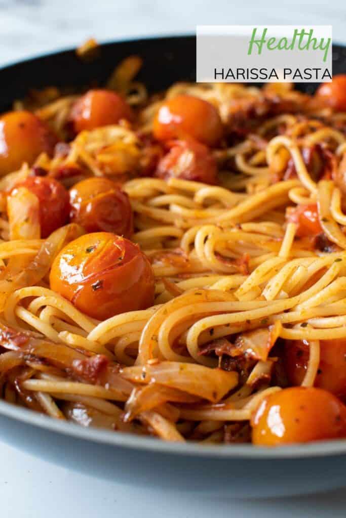 Close up of a frying pan with spicy tomato pasta.