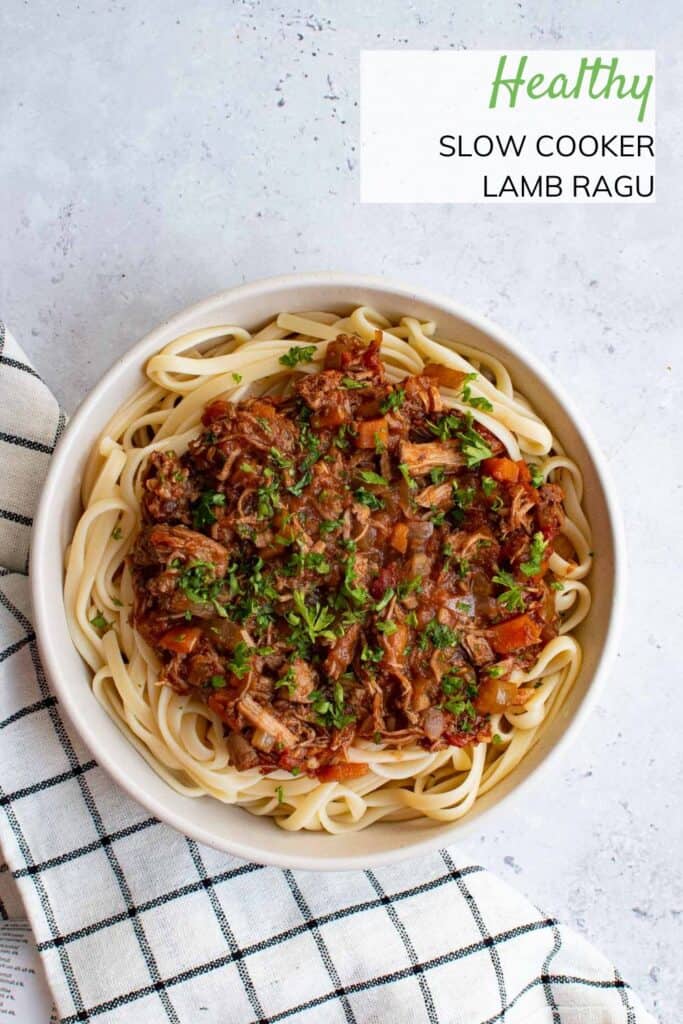 Slow Cooker Lamb Ragu on a table. The name of the dish is written above it.